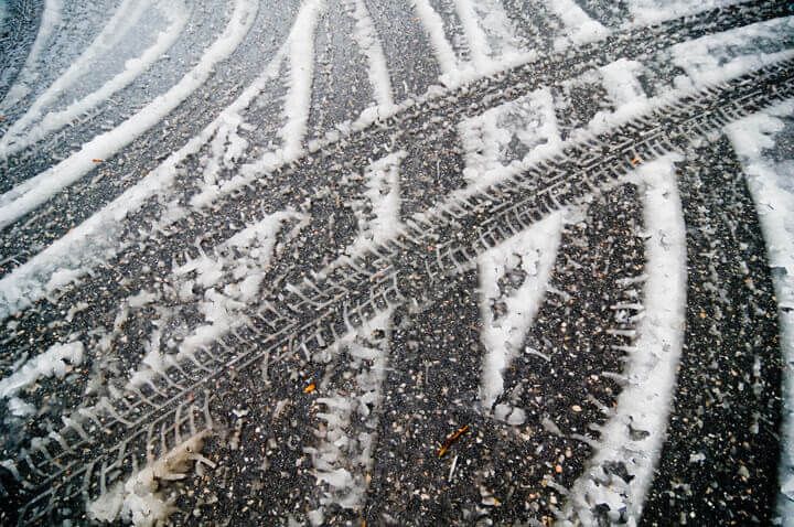 tire tracks on a light snow fall