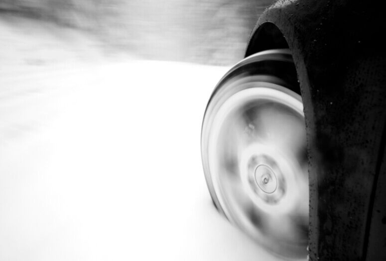 A blurry demonstration of a tire driving at high speed